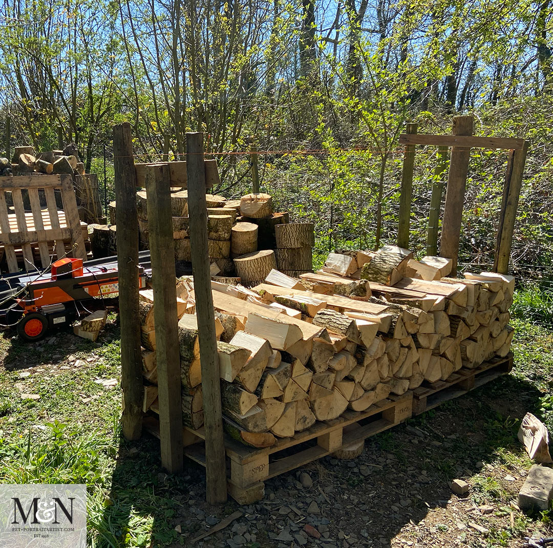 Log splitting and stacking for Melanie’s April Monthly News