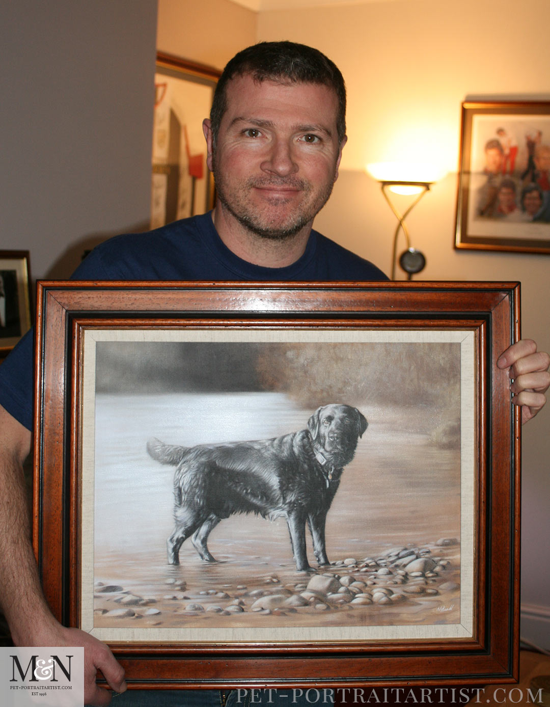 Happy Client with the oil painting of his Black Labrador